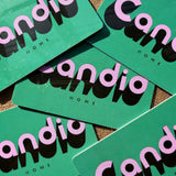 Green gift cards with 'candid home' branding on a textured surface